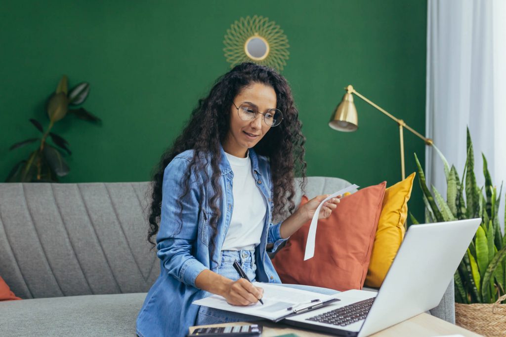 woman working online at home from laptop
